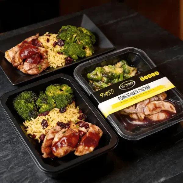 Meal prep tray with chicken, mashed potatoes, and carrots