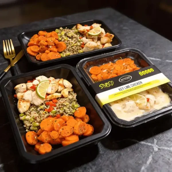 Meal prep tray with meat, vegetables, and grains